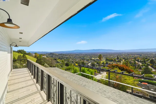 a view of city and mountain from a balcony