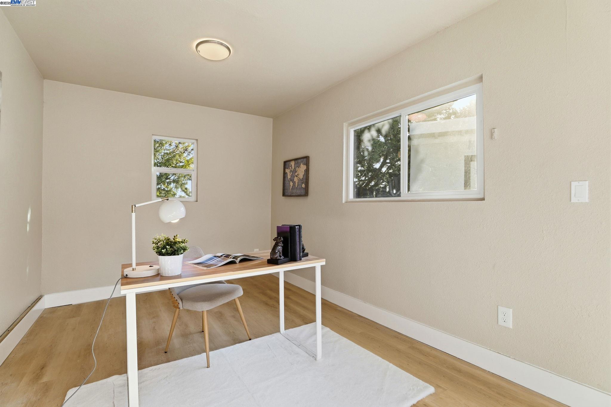 10745 Ridgeview Way San Jose, CA 95127 - Photo 35 of 54 a room with furniture a window and wooden floor