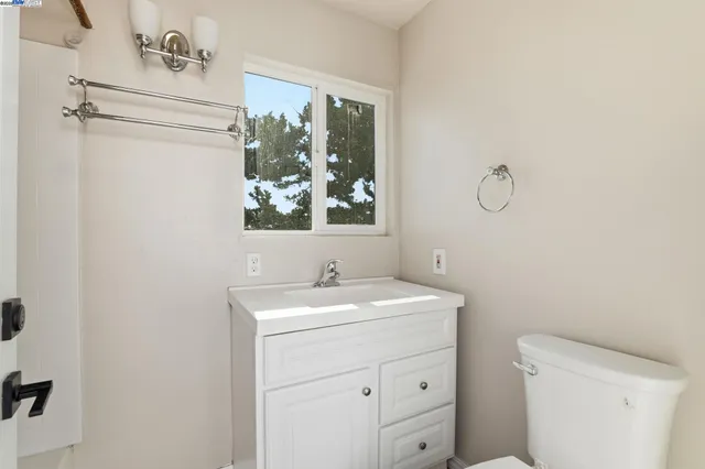 a view of a building with floor to ceiling windows and a basket ball poll