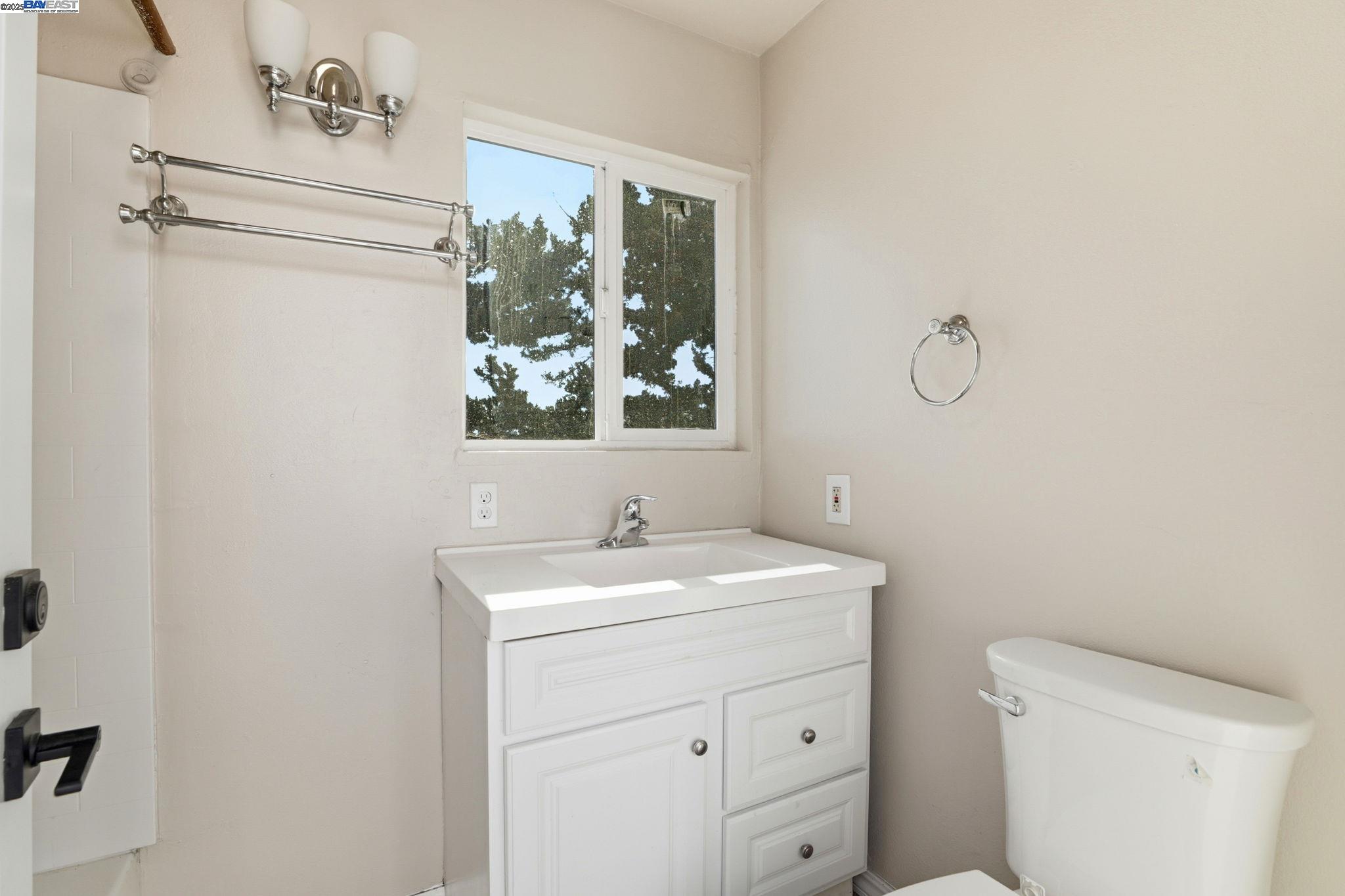10745 Ridgeview Way San Jose, CA 95127 - Photo 36 of 54 a bathroom with a toilet a sink and a mirror
