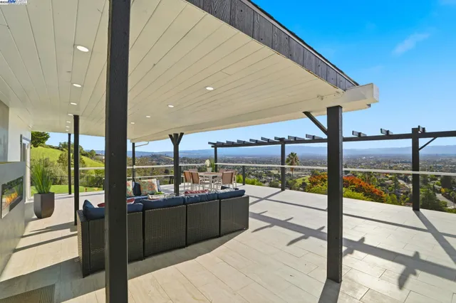 a view of a swimming pool with a lounge chair