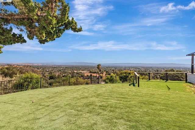 an aerial view of a house with a yard and garden