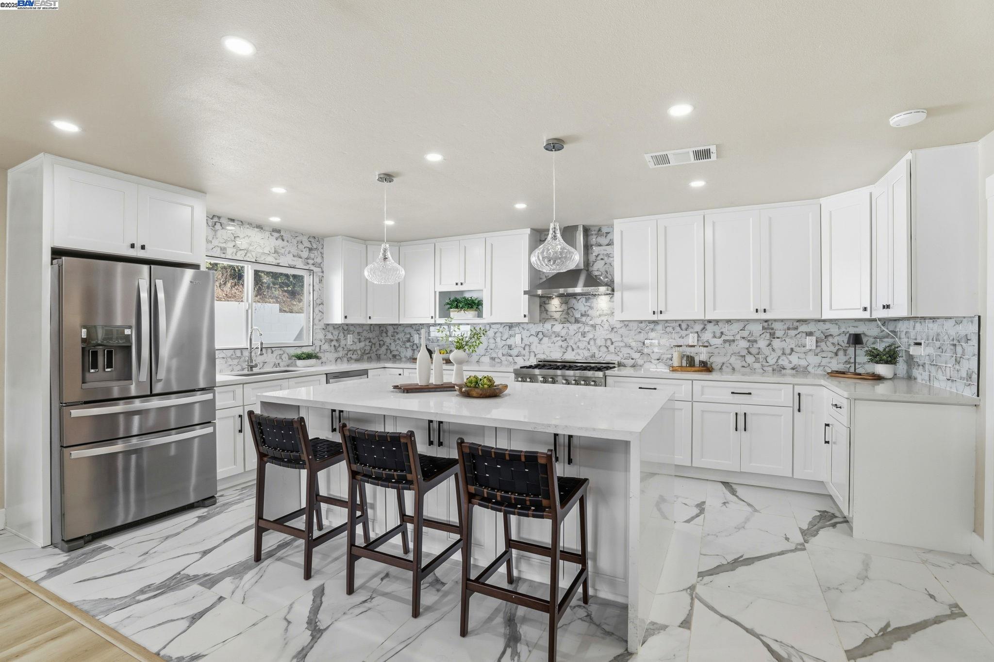10745 Ridgeview Way San Jose, CA 95127 - Photo 10 of 54 a kitchen with kitchen island cabinets and chairs