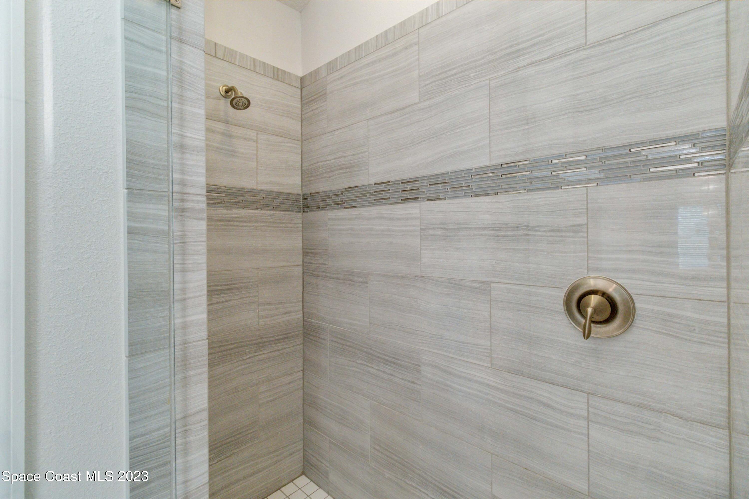 4215 Ruthann Circle Melbourne, FL 32934 - Photo 25 of 41 a bathroom with a shower