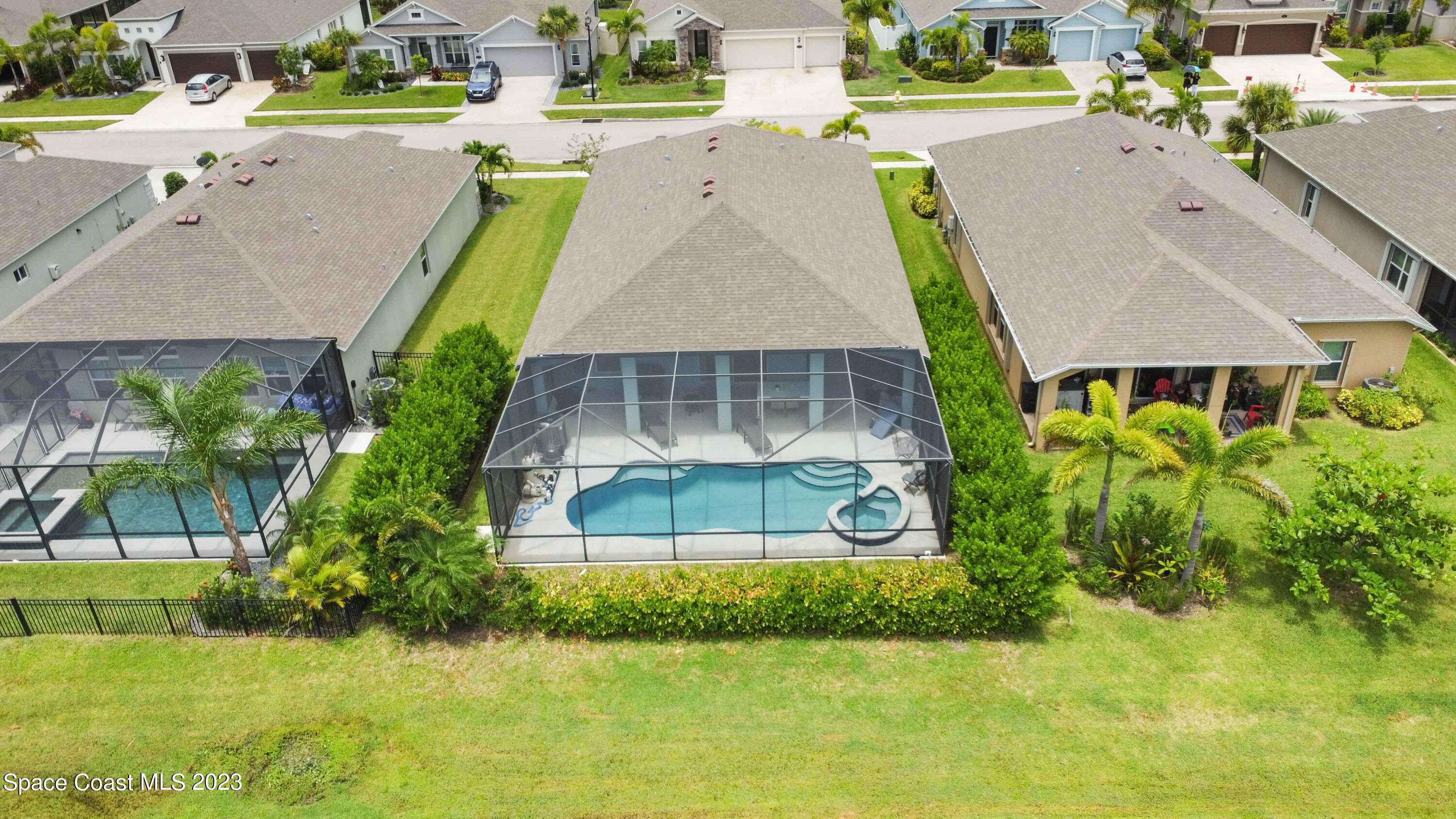 4215 Ruthann Circle Melbourne, FL 32934 - Photo 36 of 41 an aerial view of a house with a swimming pool