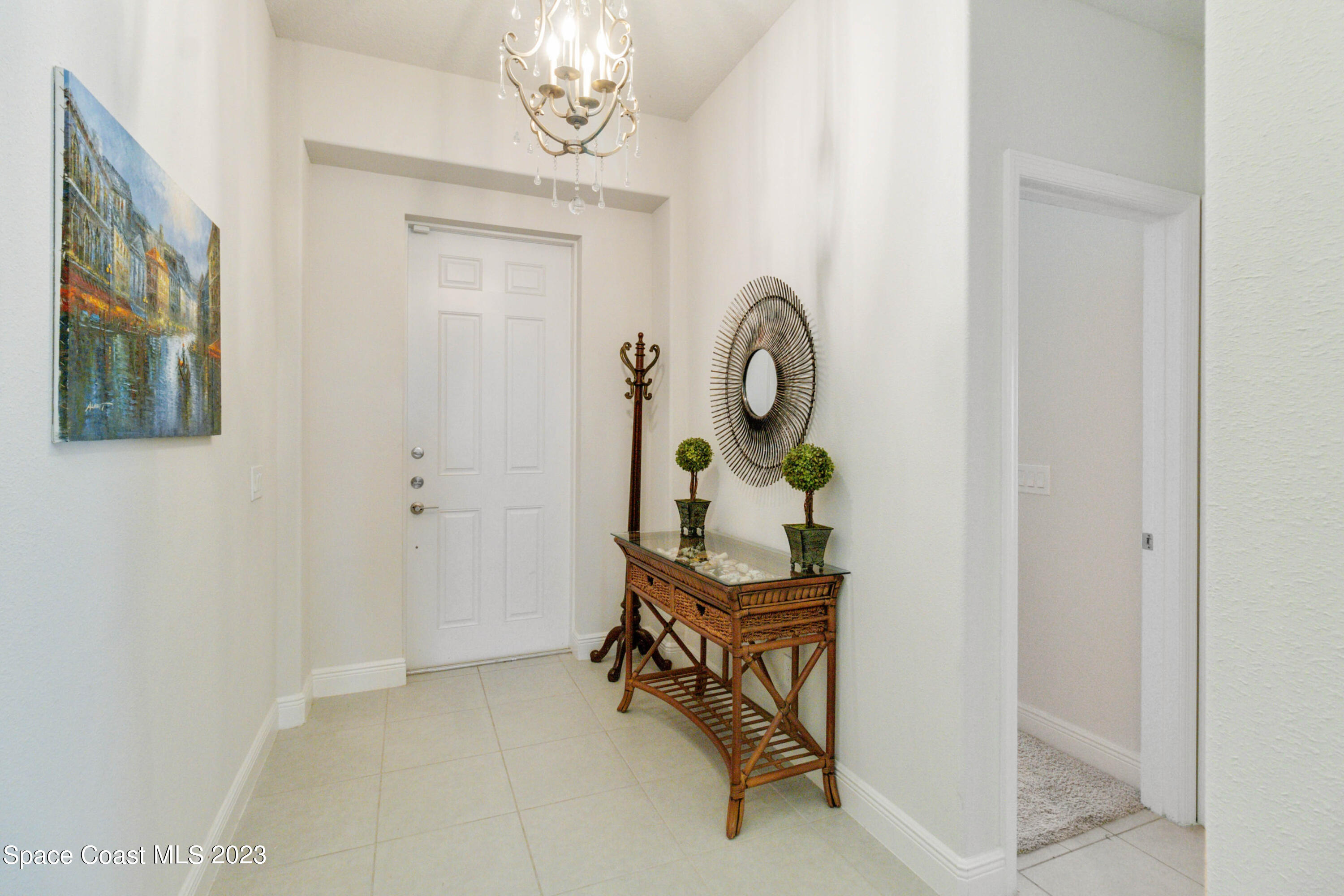 4215 Ruthann Circle Melbourne, FL 32934 - Photo 4 of 41 a living room with furniture and a mirror