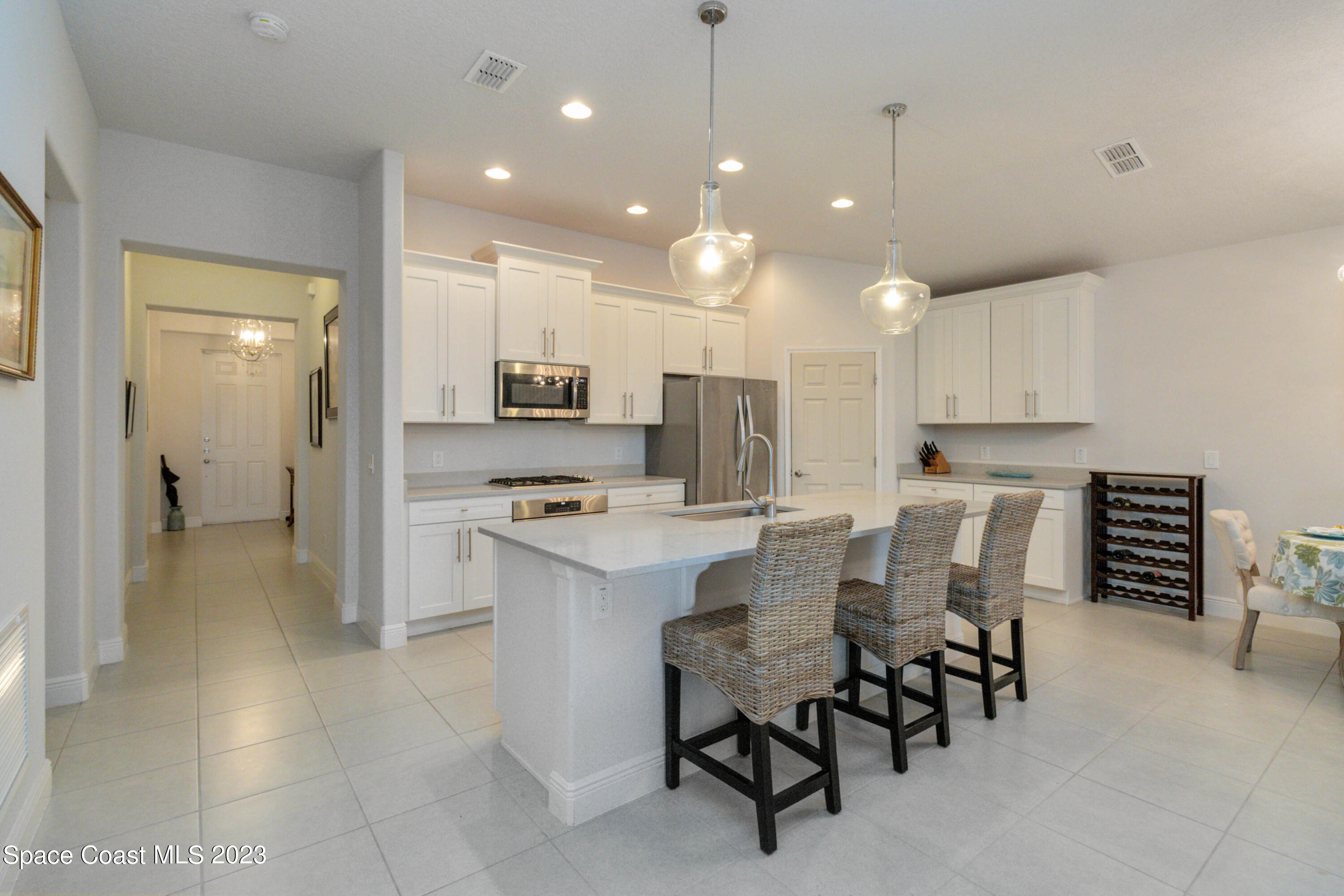 4215 Ruthann Circle Melbourne, FL 32934 - Photo 8 of 41 a large kitchen with a table and chairs