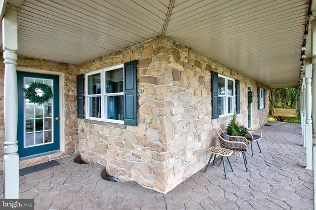 a view of a backyard with large trees