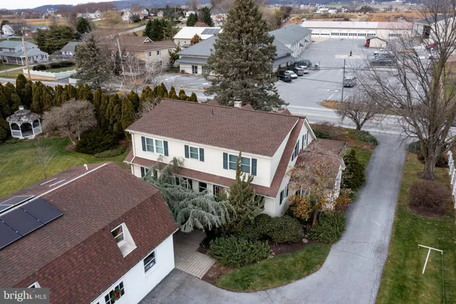 an aerial view of a house with a garden