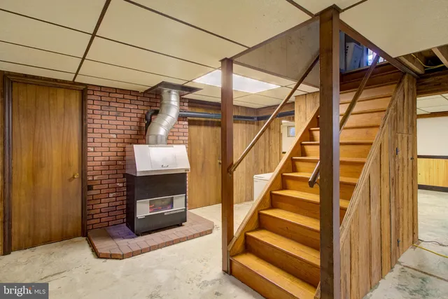 a bedroom with a bed and a mirror