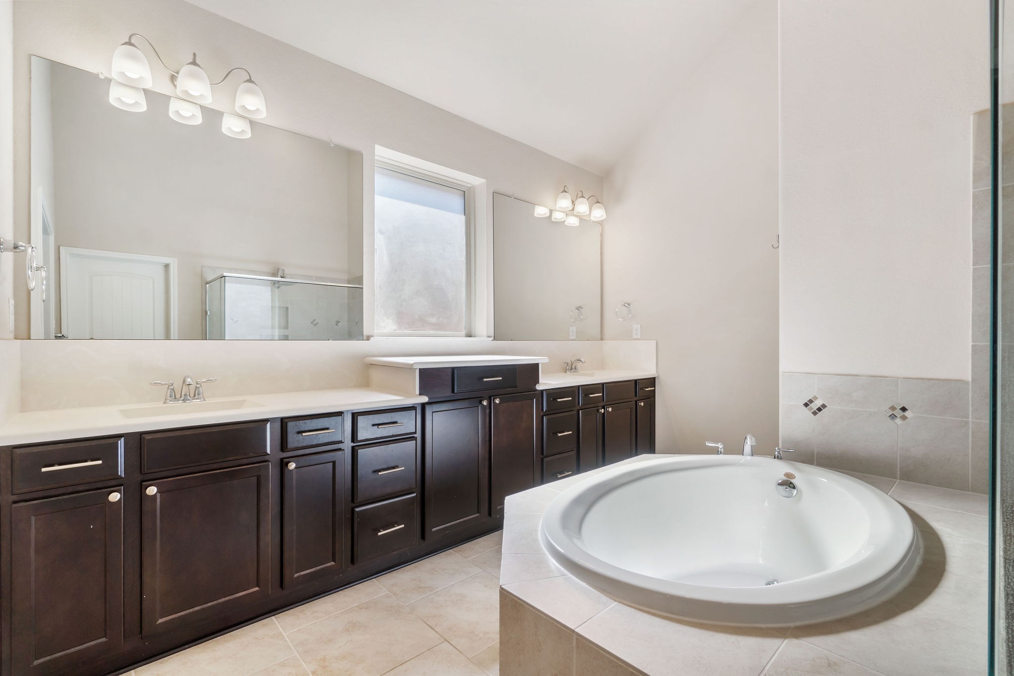 22314 Forbes Field Trail Spring, TX 77389 - Photo 22 of 46 Plenty of room getting ready here with his and hers sinks with solid surface integrated bowls and extended countertops. Vanity area separates the two sinks.