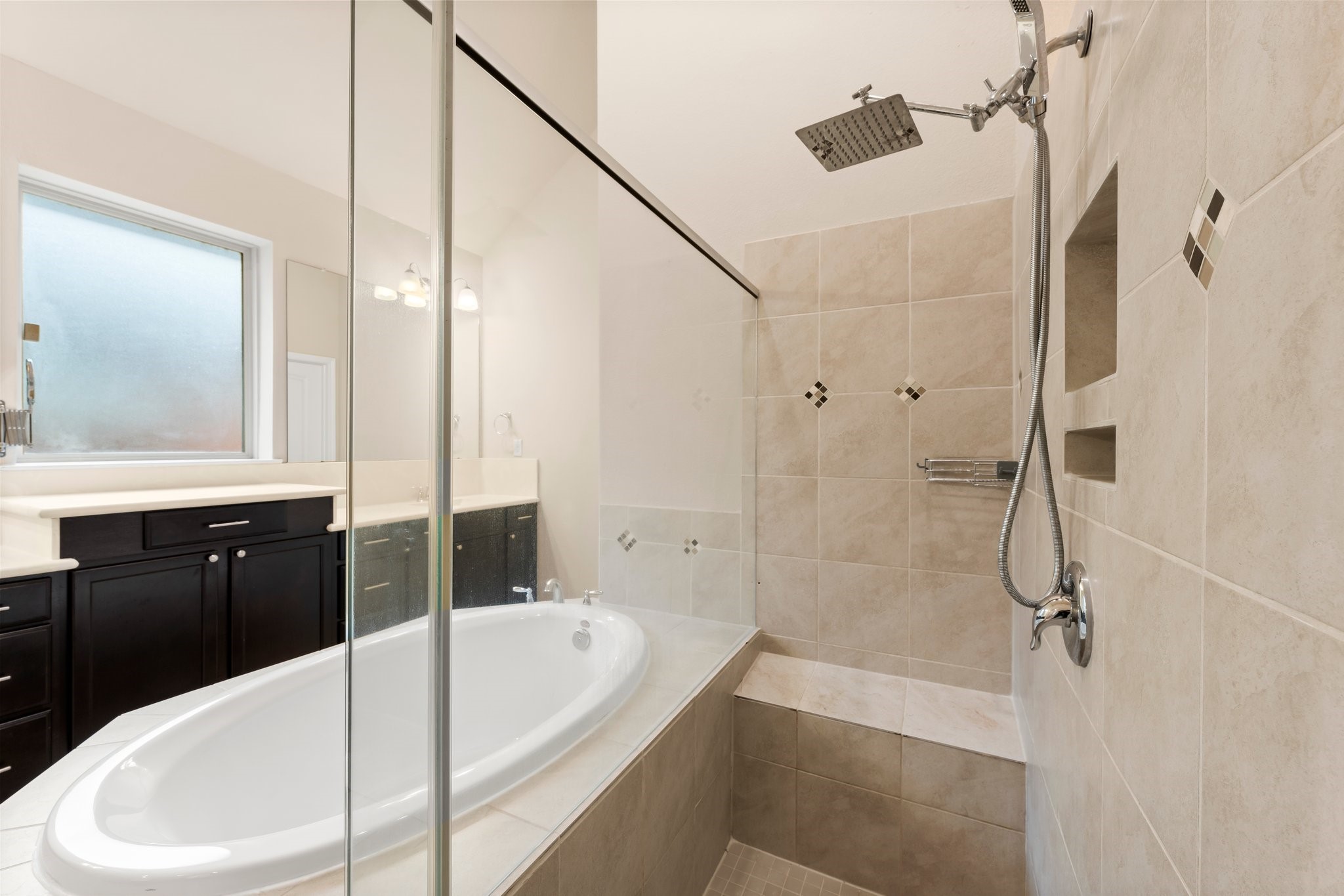 22314 Forbes Field Trail Spring, TX 77389 - Photo 24 of 46 Huge shower with built-in toiletry cubby, bench seat, and rain shower head with additional handheld sprayer option.