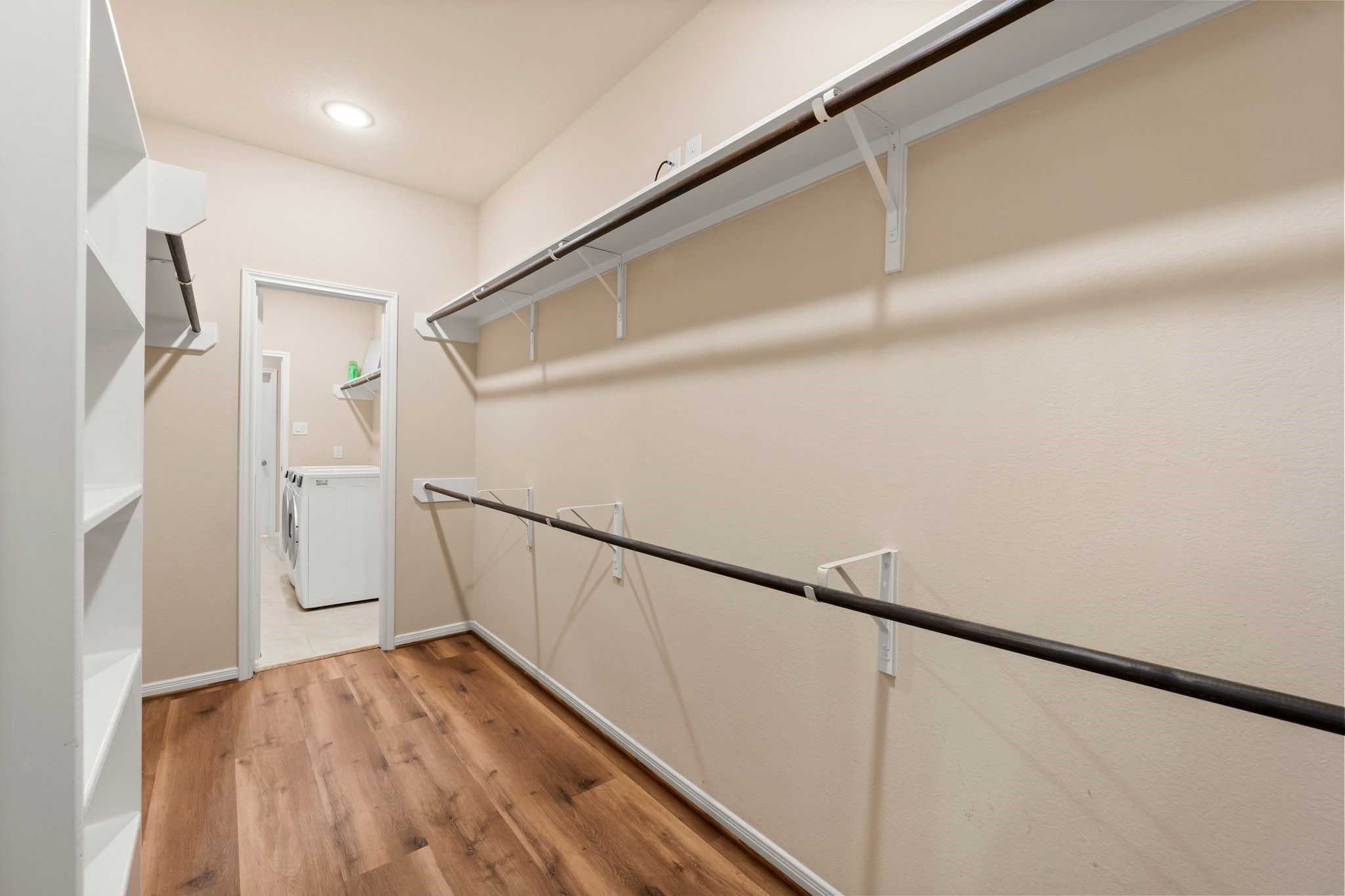 22314 Forbes Field Trail Spring, TX 77389 - Photo 26 of 46 Enter the huge closet through the master bath. The closet boasts tons of hanging space as well as built-in shelves. Straight ahead, you see another door which leads to the laundry room. Super convenient come laundry time!