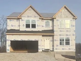 a front view of a house with a outdoor space