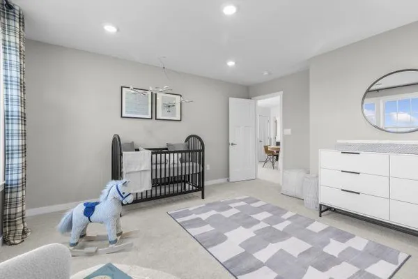 a bedroom with a bed and lamp