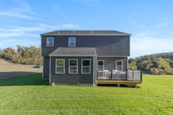 a view of a livingroom with furniture and window