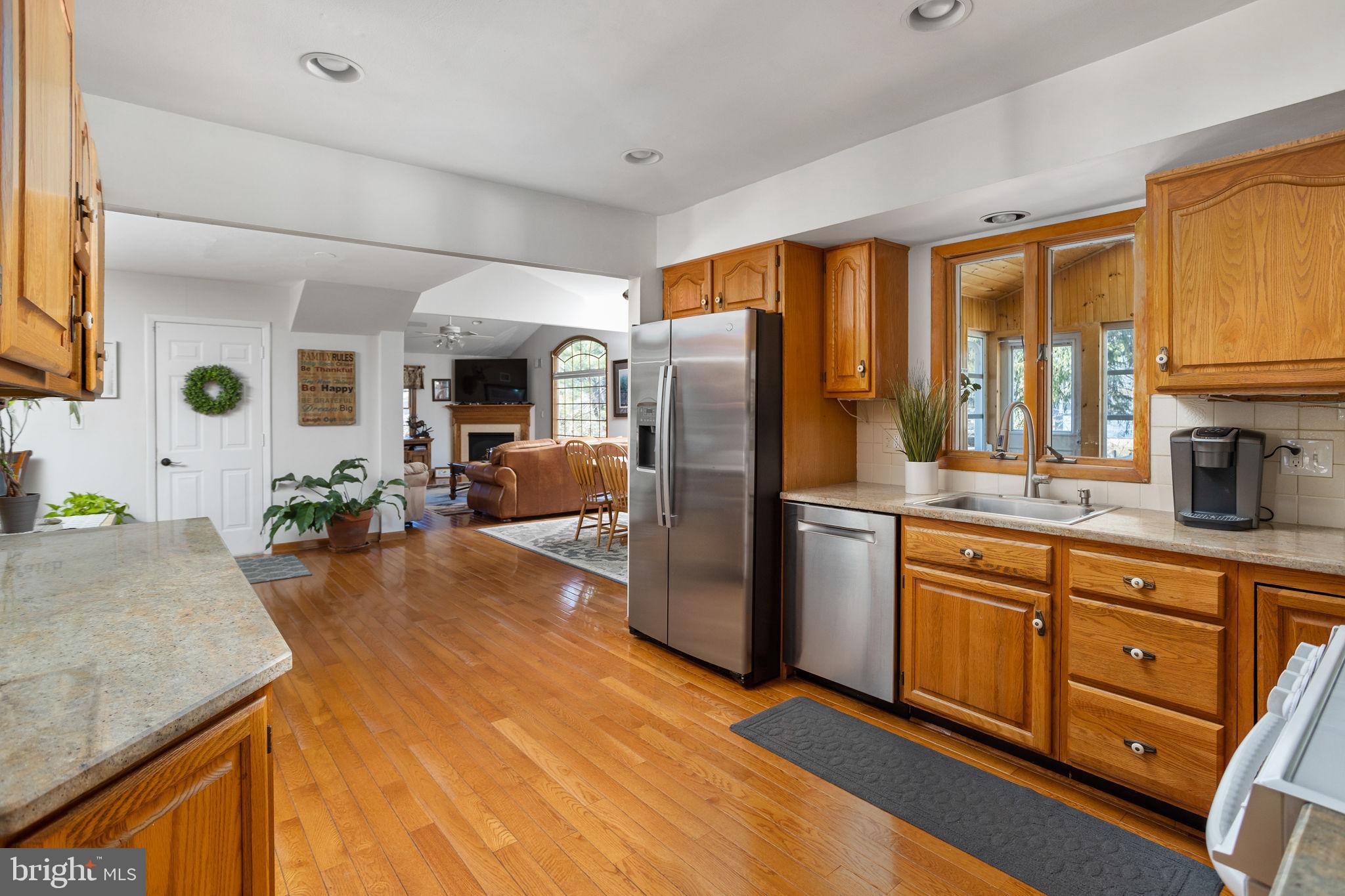 9 Sabrina Drive Ewing, NJ 08618 - Photo 15 of 49 a kitchen with stainless steel appliances granite countertop a refrigerator a stove and a sink with cabinets