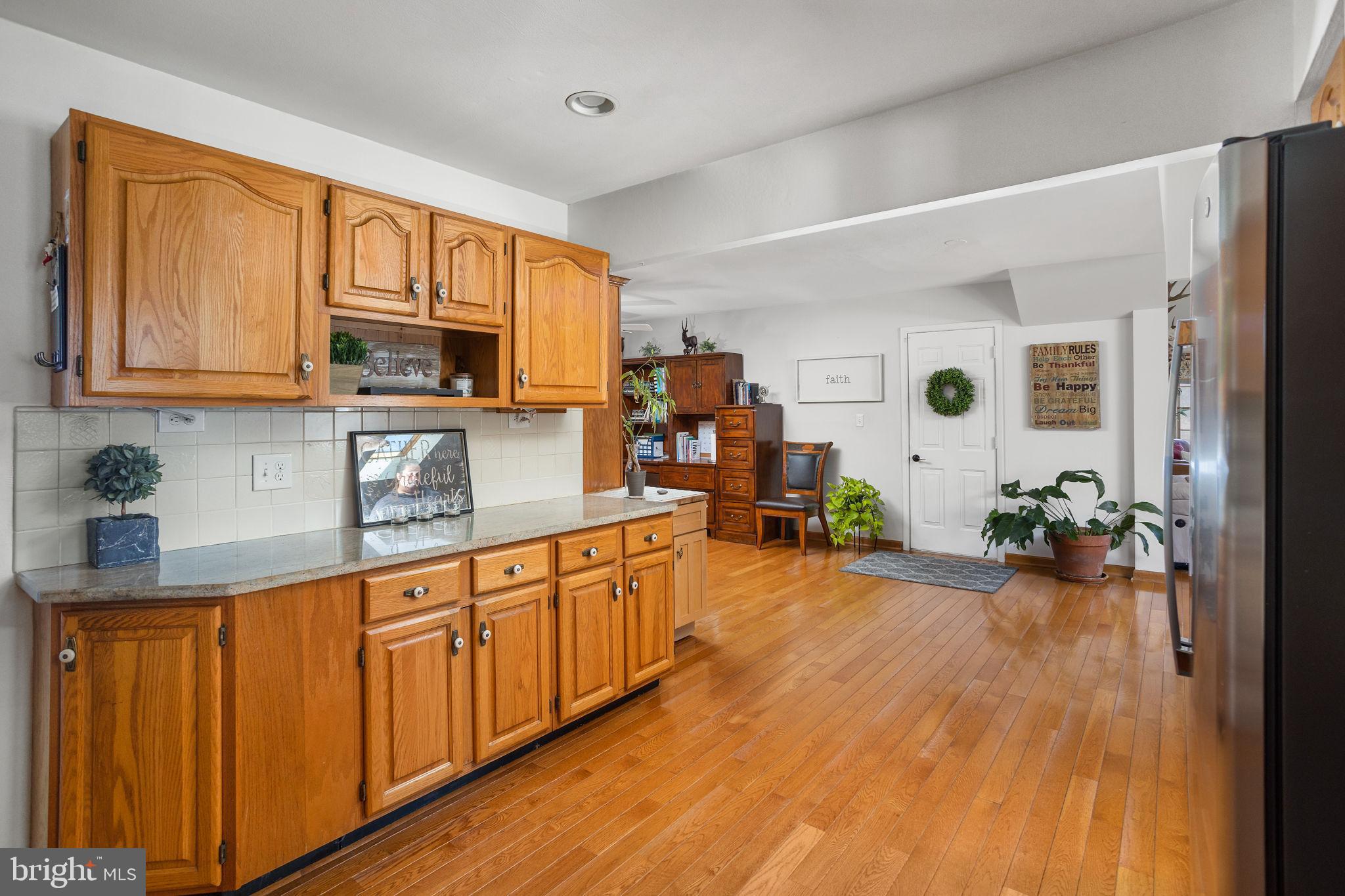 9 Sabrina Drive Ewing, NJ 08618 - Photo 16 of 49 a large kitchen with wooden floors and stainless steel appliances