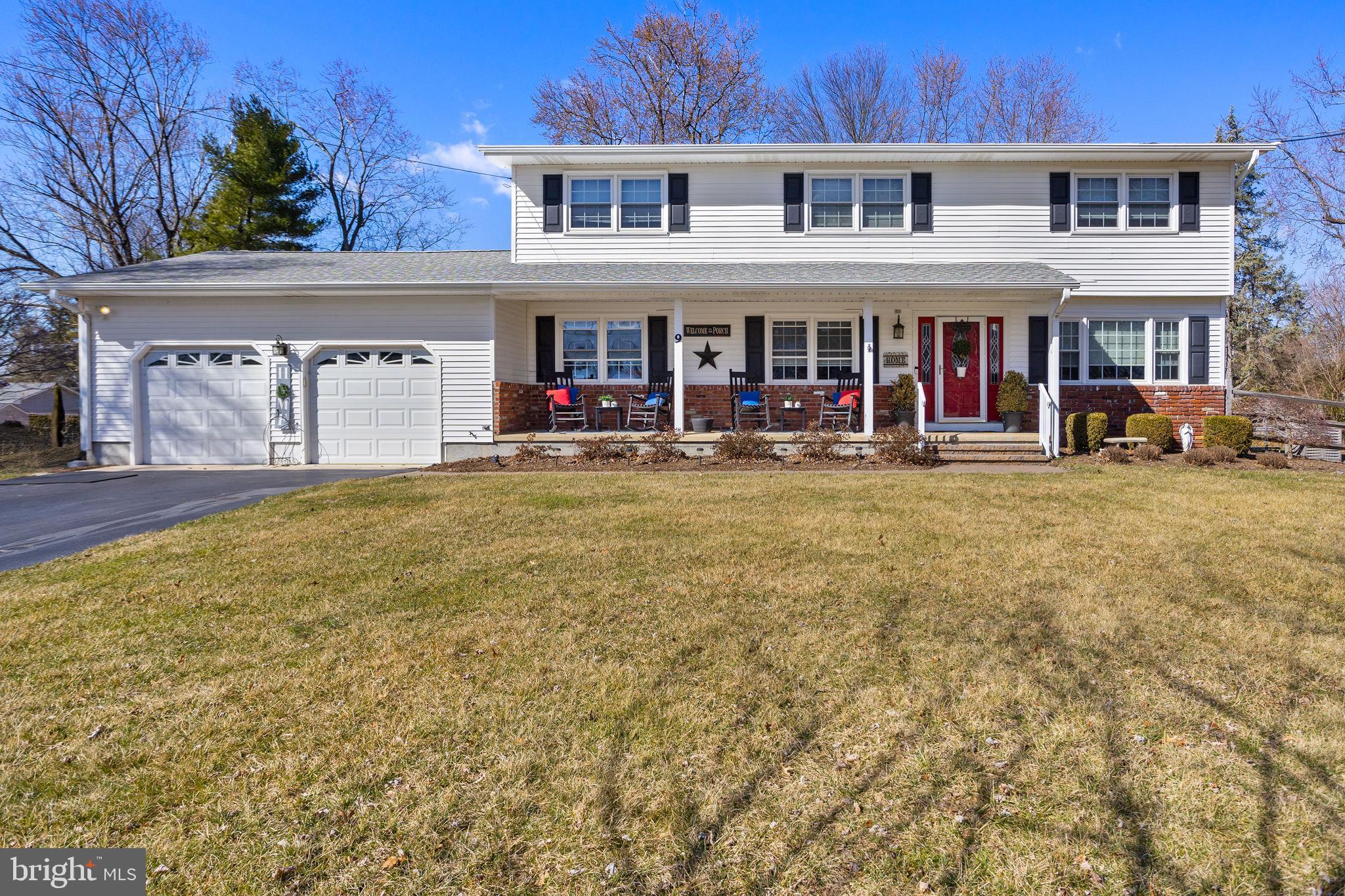 9 Sabrina Drive Ewing, NJ 08618 - Photo 2 of 49 a view of a building with a garden and large trees