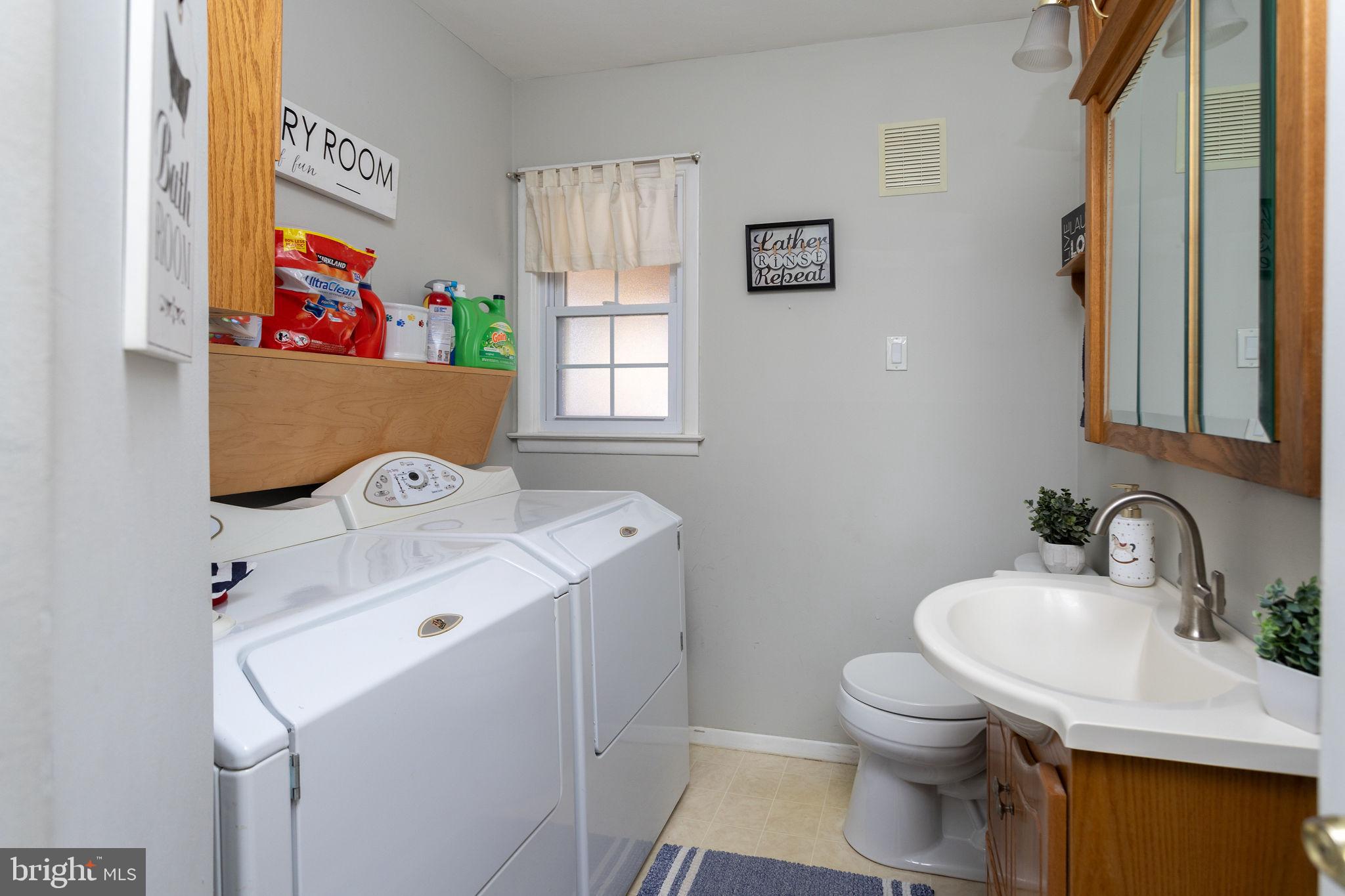 9 Sabrina Drive Ewing, NJ 08618 - Photo 28 of 49 a bathroom with a sink and a washer dryer