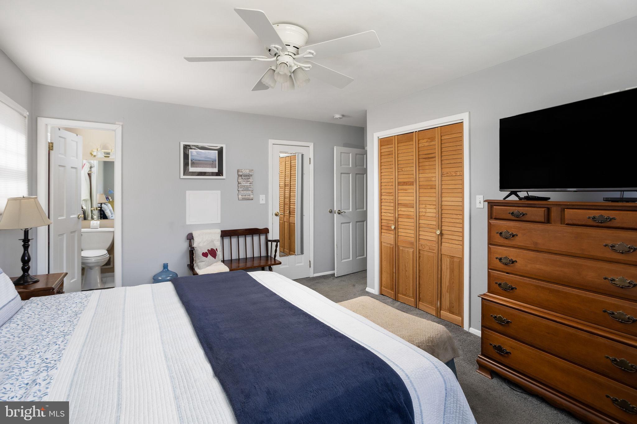 9 Sabrina Drive Ewing, NJ 08618 - Photo 30 of 49 a bedroom with a bed and a flat screen tv