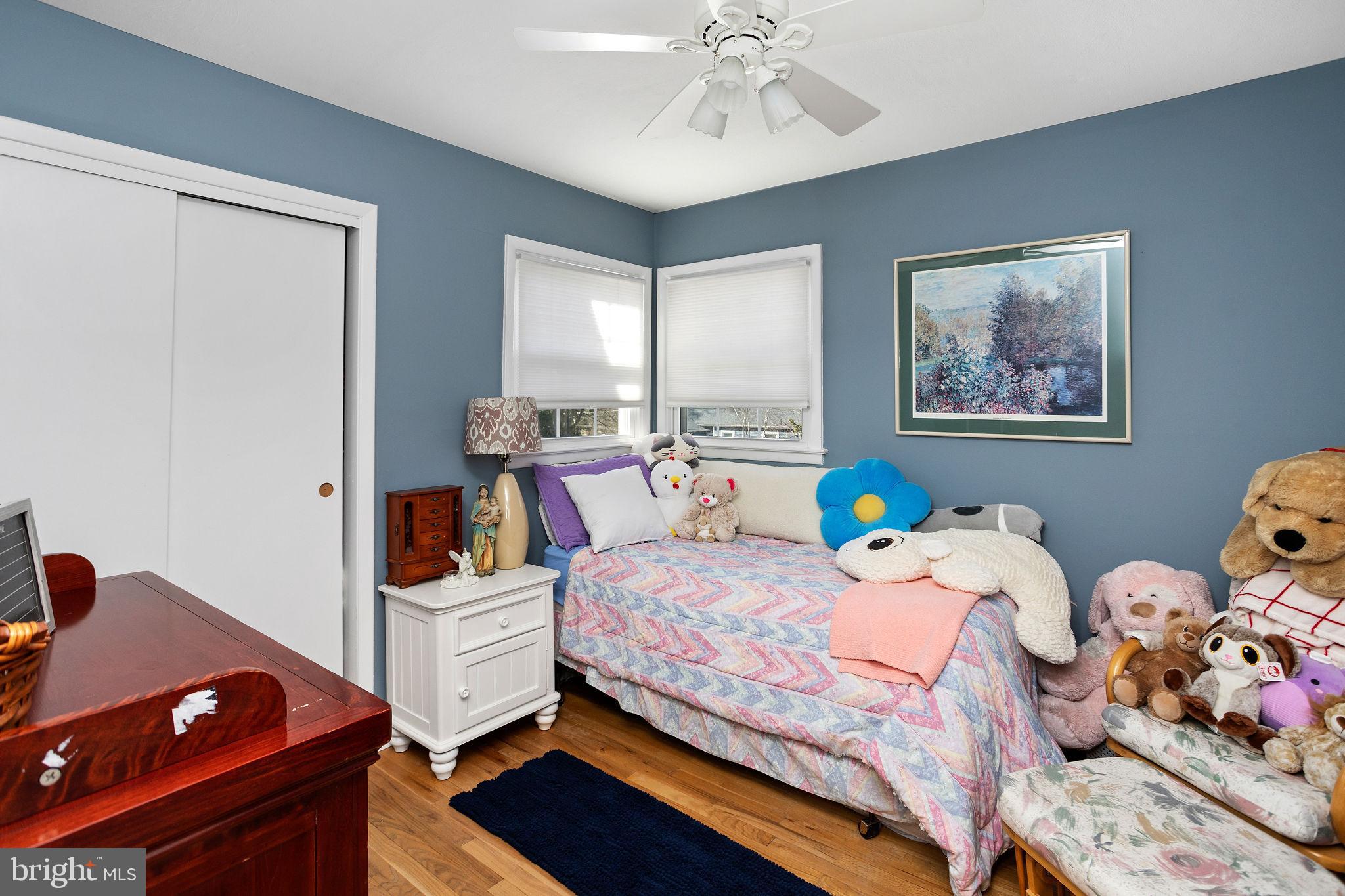 9 Sabrina Drive Ewing, NJ 08618 - Photo 35 of 49 a bedroom with a bed and wooden floor