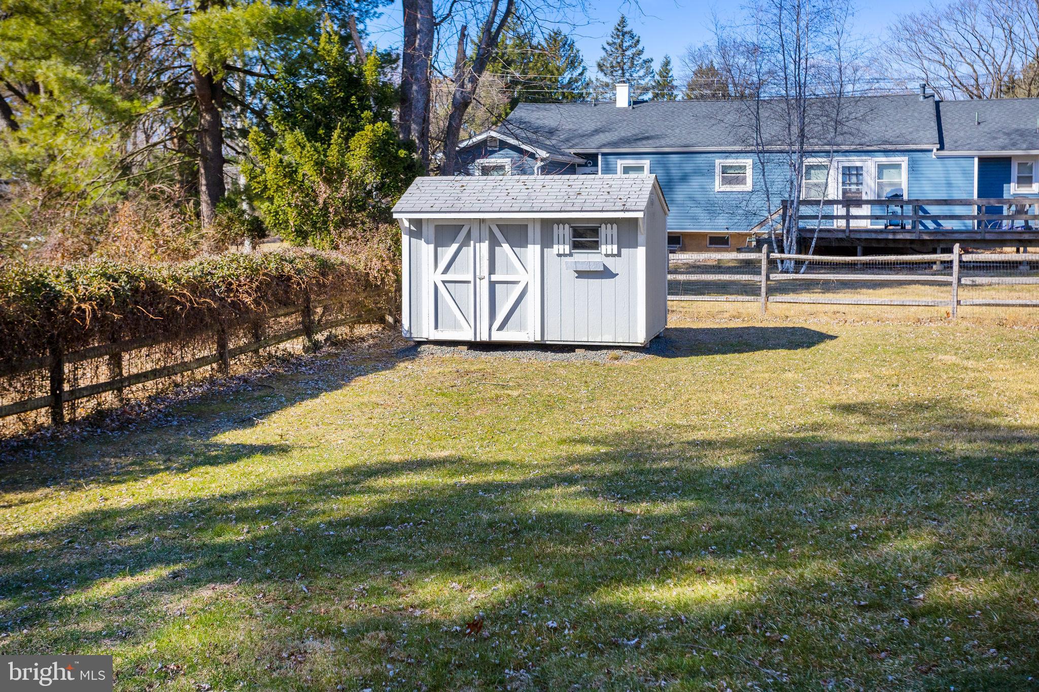 9 Sabrina Drive Ewing, NJ 08618 - Photo 44 of 49 a view of a swimming pool with a lawn chairs under an umbrella