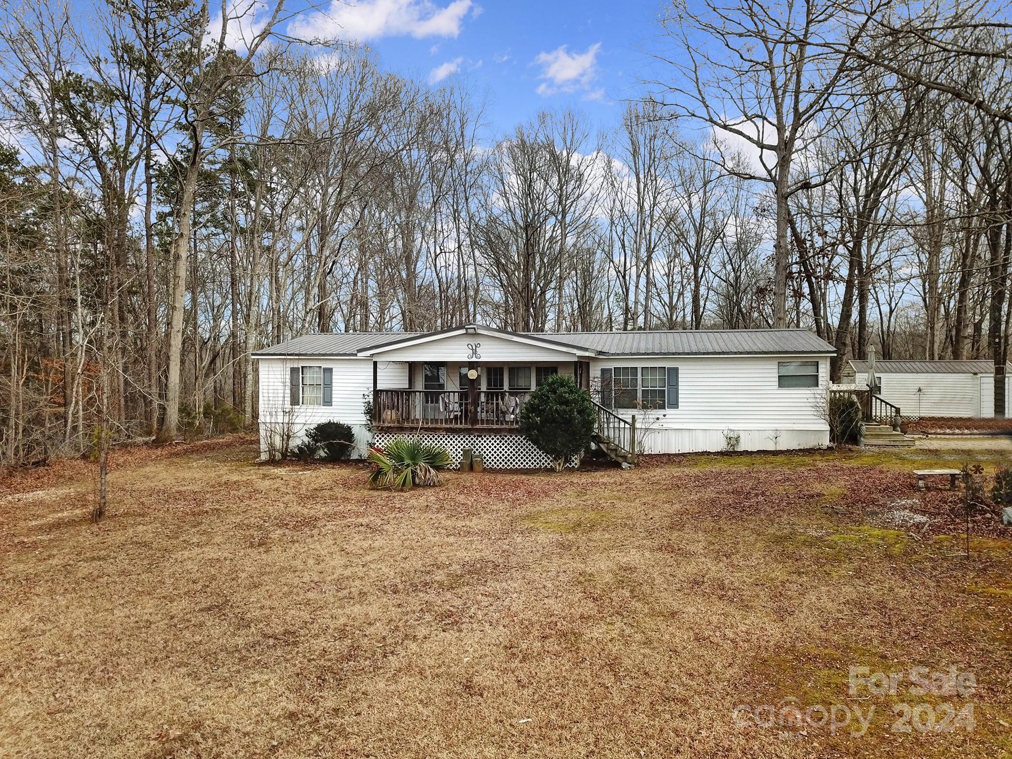 1950 Knight Road Lancaster, SC 29720 - Photo 3 of 24 a view of a house with a yard covered with snow in the background