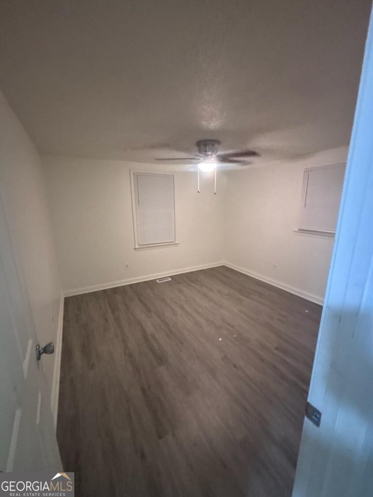 172 Randall Avenue Flovilla, GA 30216 - Photo 3 of 10 a view of a room with wooden floor