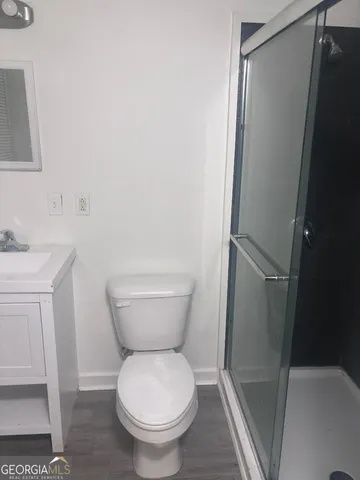 a bathroom with a toilet and a sink