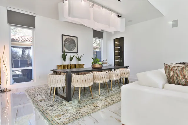 a living room with furniture and a rug
