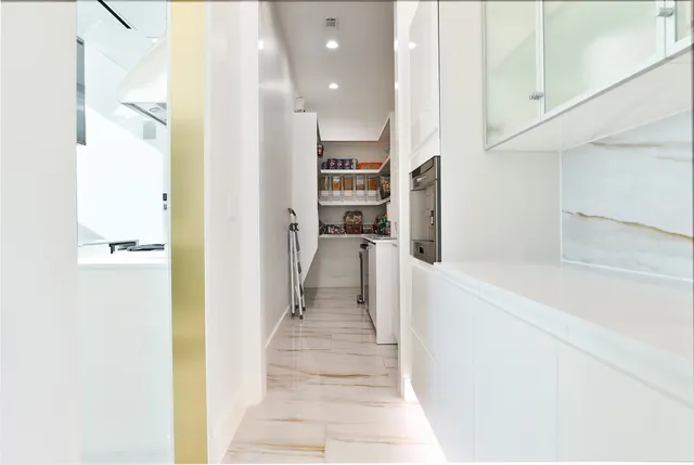 a view of living room with granite countertop and white walls