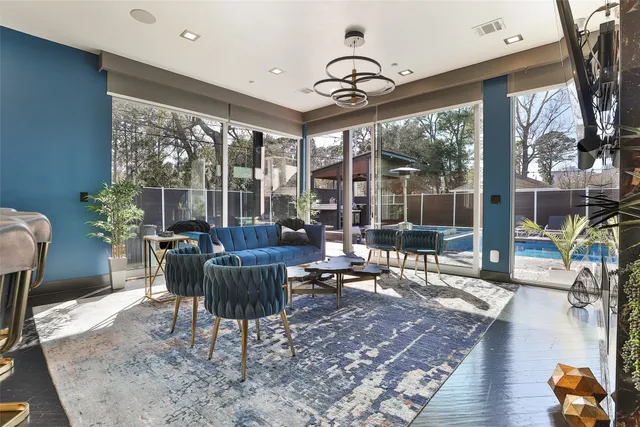 a large kitchen with stainless steel appliances granite countertop a stove a sink and a microwave