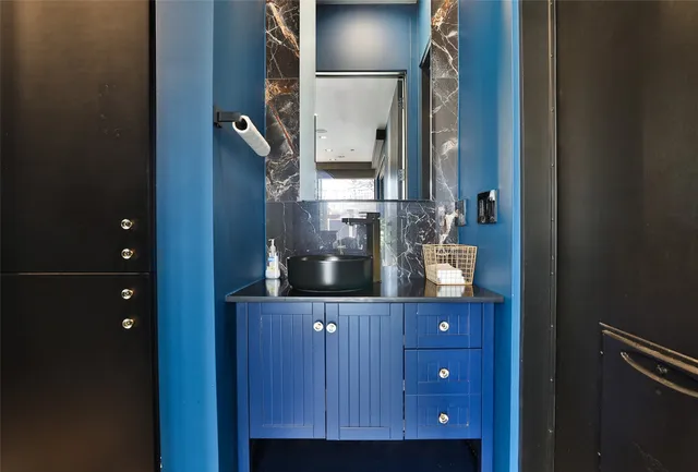 a bathroom with a toilet and shower curtain