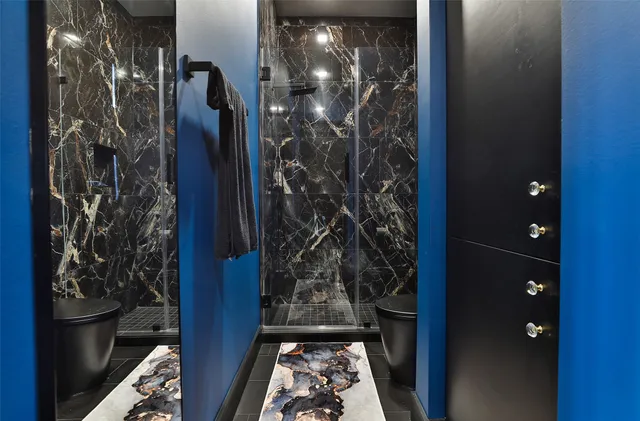 a spacious bedroom with a bed and a large window