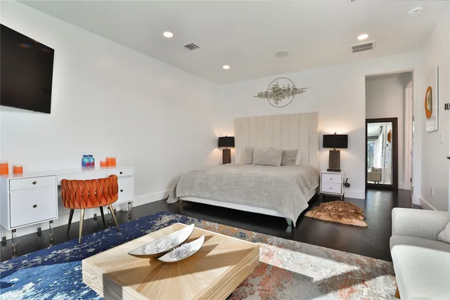a bathroom with a double vanity sink toilet and shower