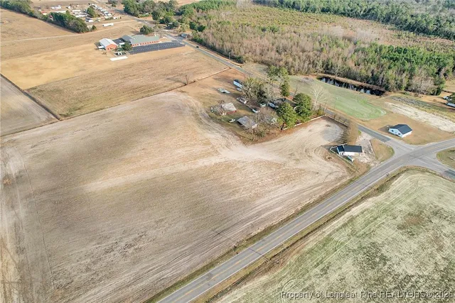 swimming pool view with a lake view