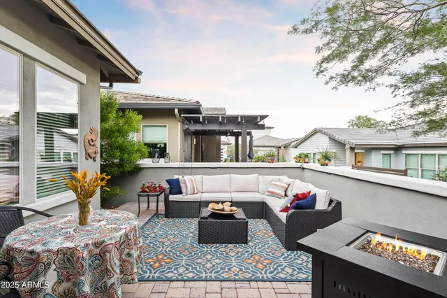 a table and chairs sitting in front of a house