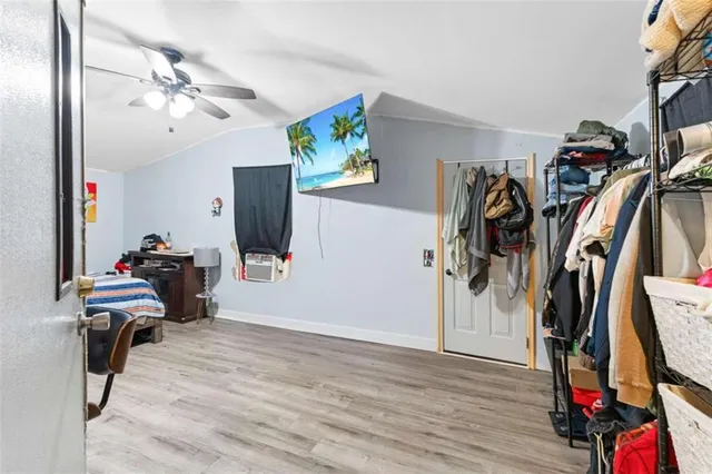 a bathroom with a toilet and a shower curtain