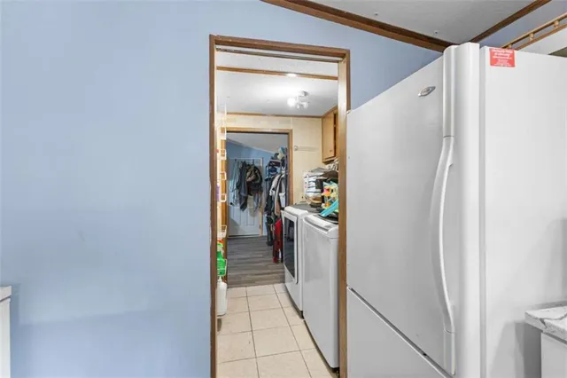a view of a livingroom with furniture and an empty room