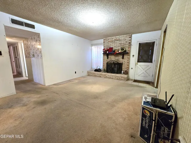 a view of a livingroom with a fireplace