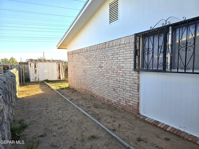 a view of an empty room with a fireplace