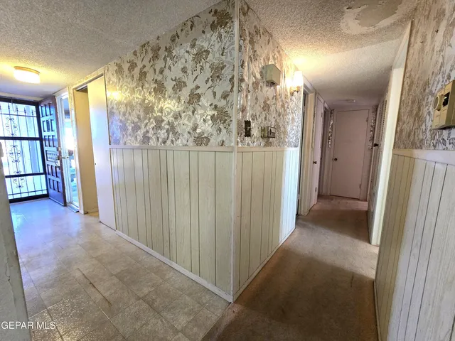 a view of a hallway with windows