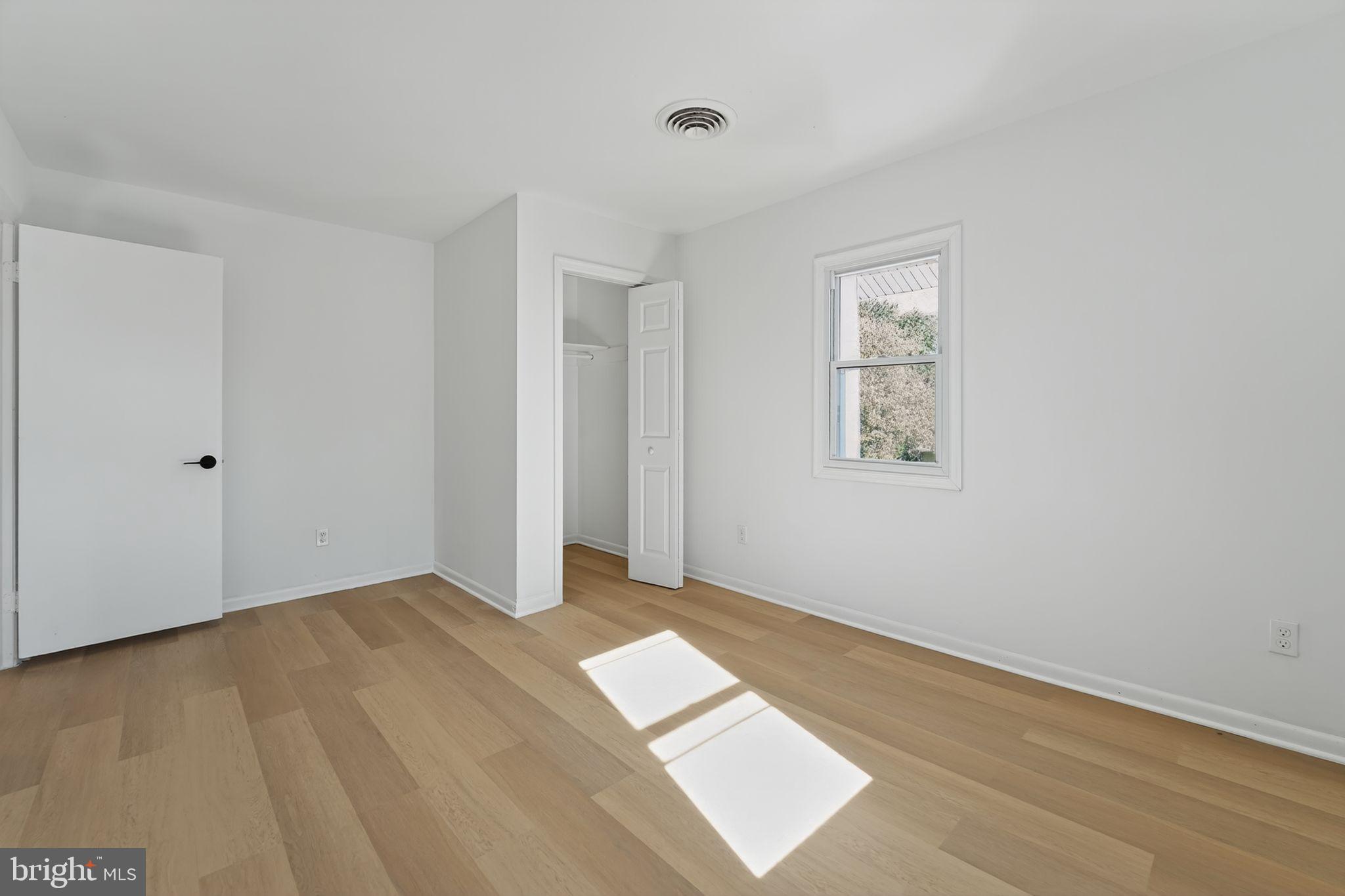 1008 Fuselage Avenue Baltimore, MD 21220 - Photo 18 of 30 an empty room with windows