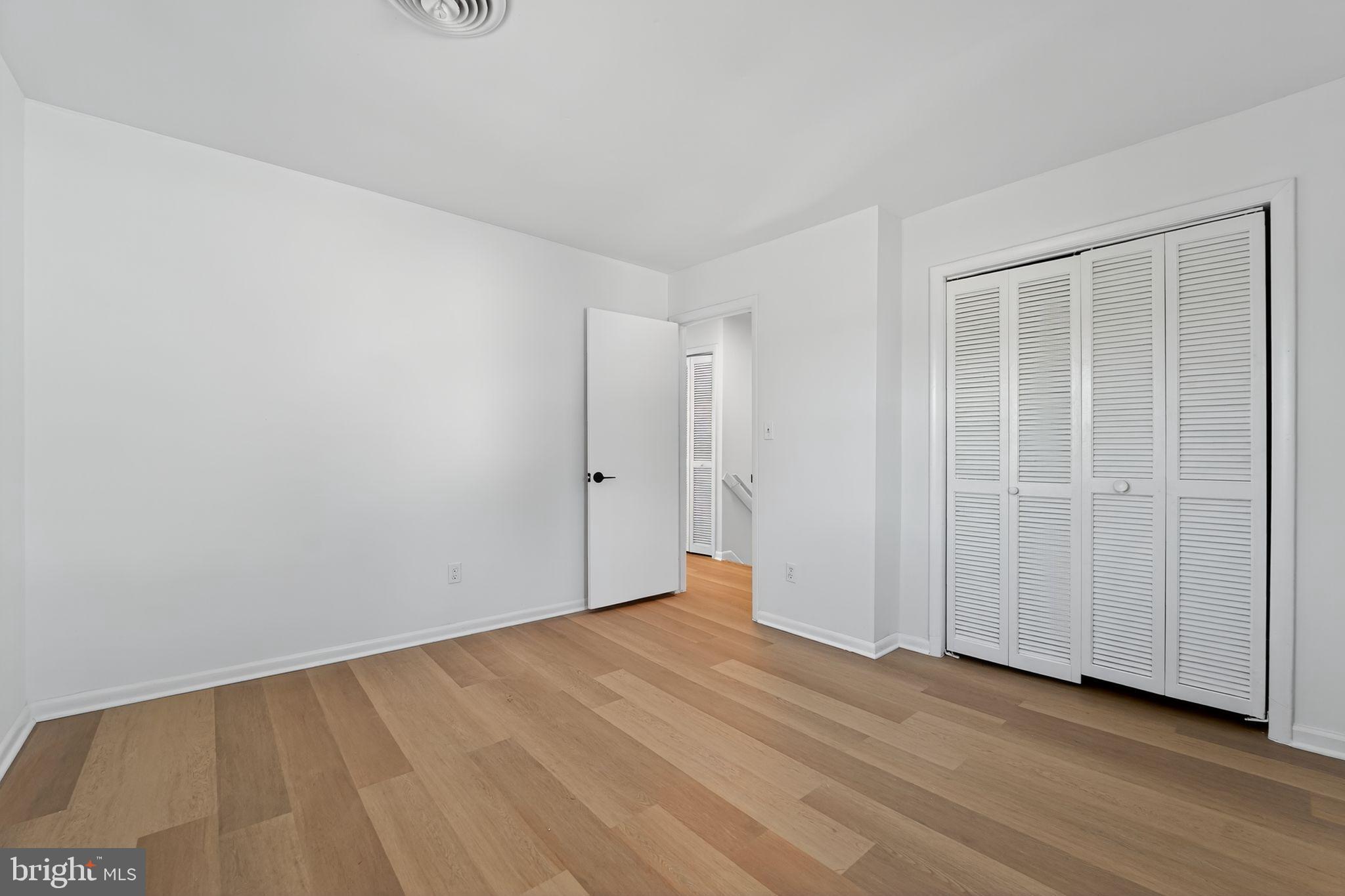 1008 Fuselage Avenue Baltimore, MD 21220 - Photo 19 of 30 a view of an empty room with wooden floor