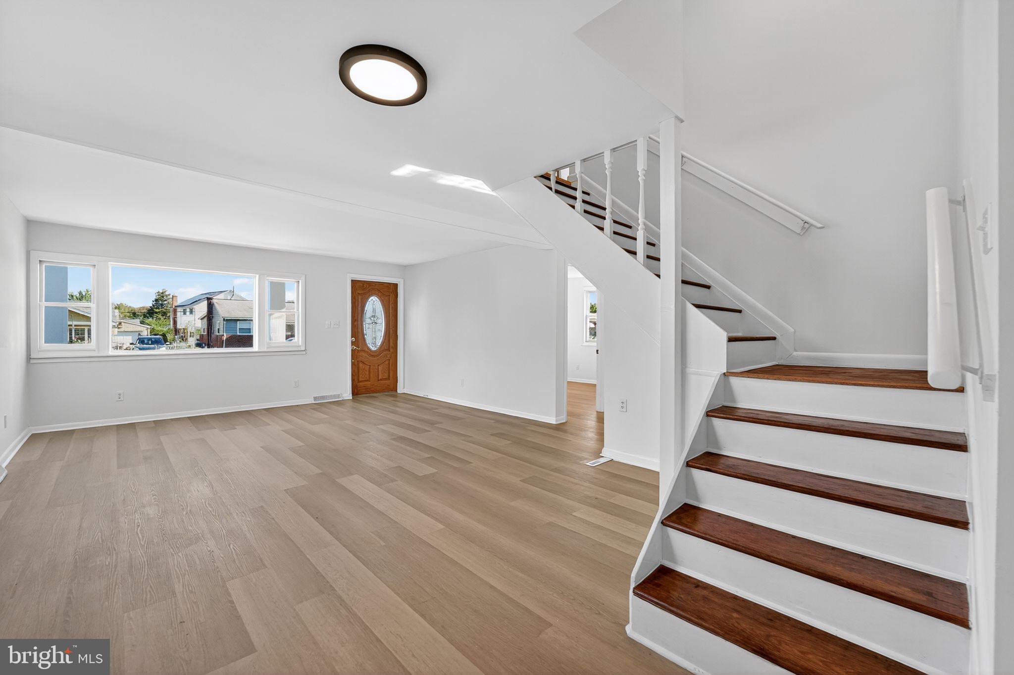 1008 Fuselage Avenue Baltimore, MD 21220 - Photo 2 of 30 a view of entryway and hall with wooden floor