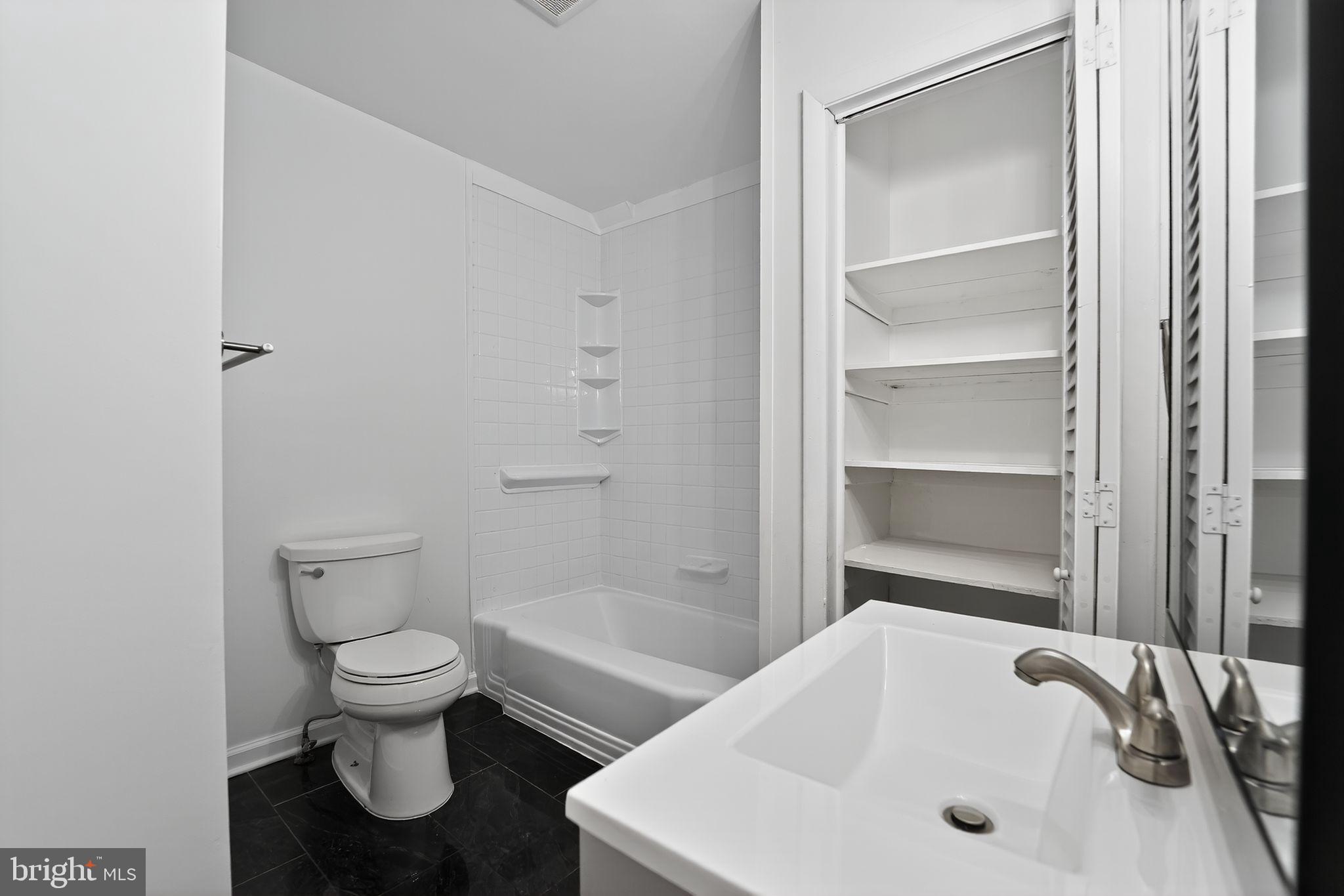 1008 Fuselage Avenue Baltimore, MD 21220 - Photo 24 of 30 a bathroom with a sink and toilet