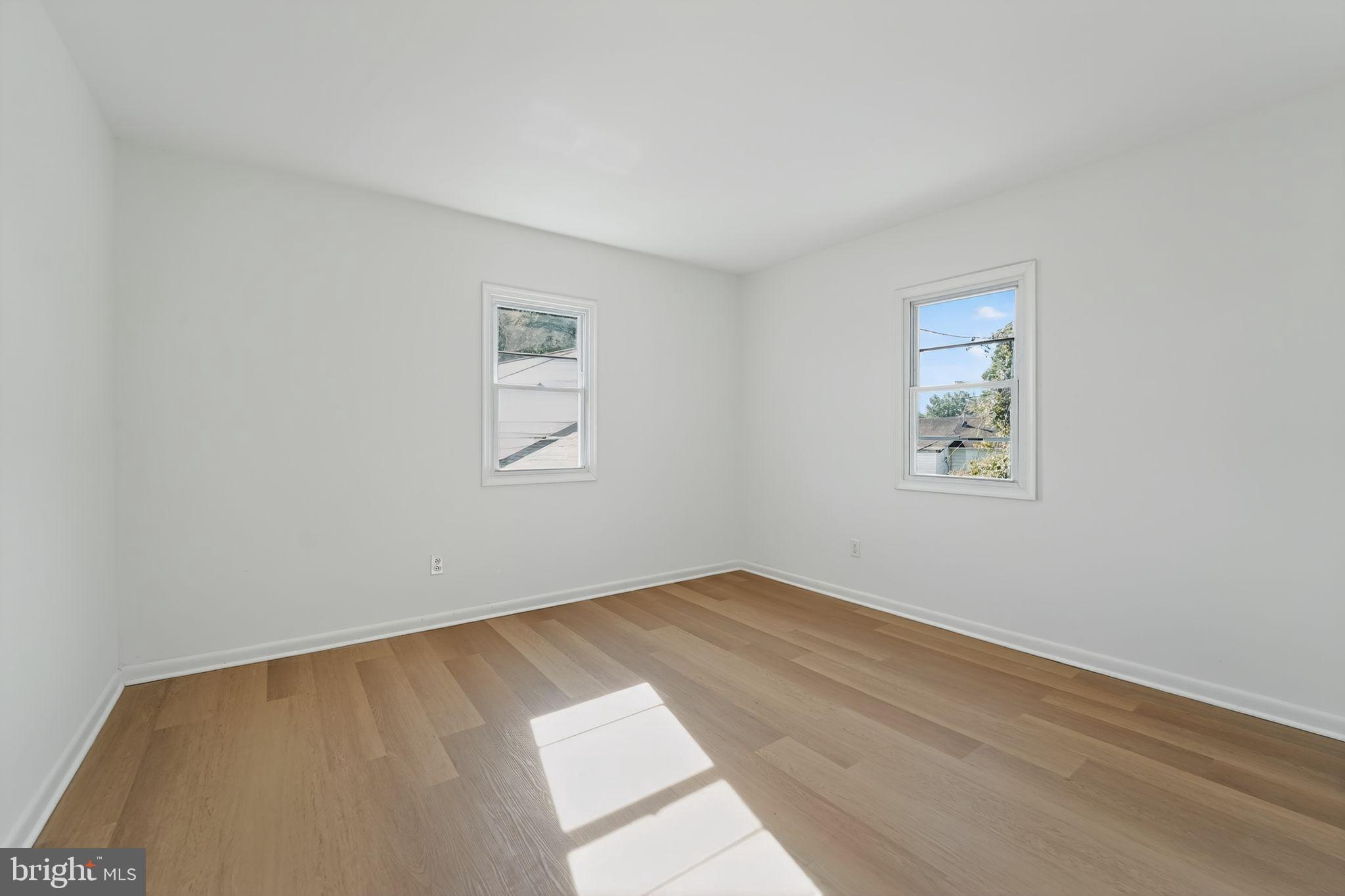 1008 Fuselage Avenue Baltimore, MD 21220 - Photo 7 of 30 an empty room with a window