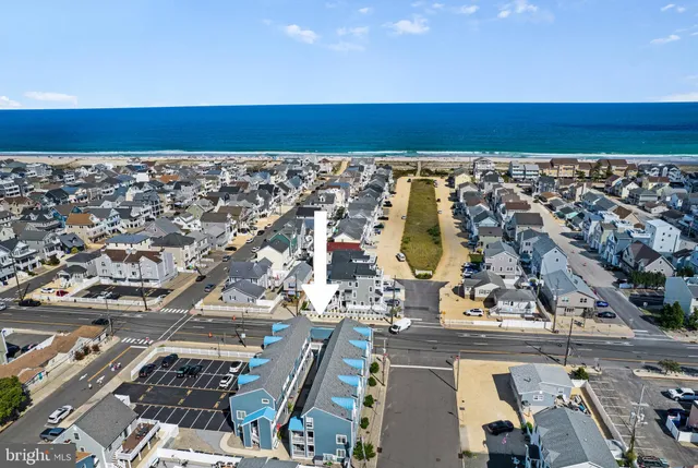 an aerial view of multiple houses with outdoor space