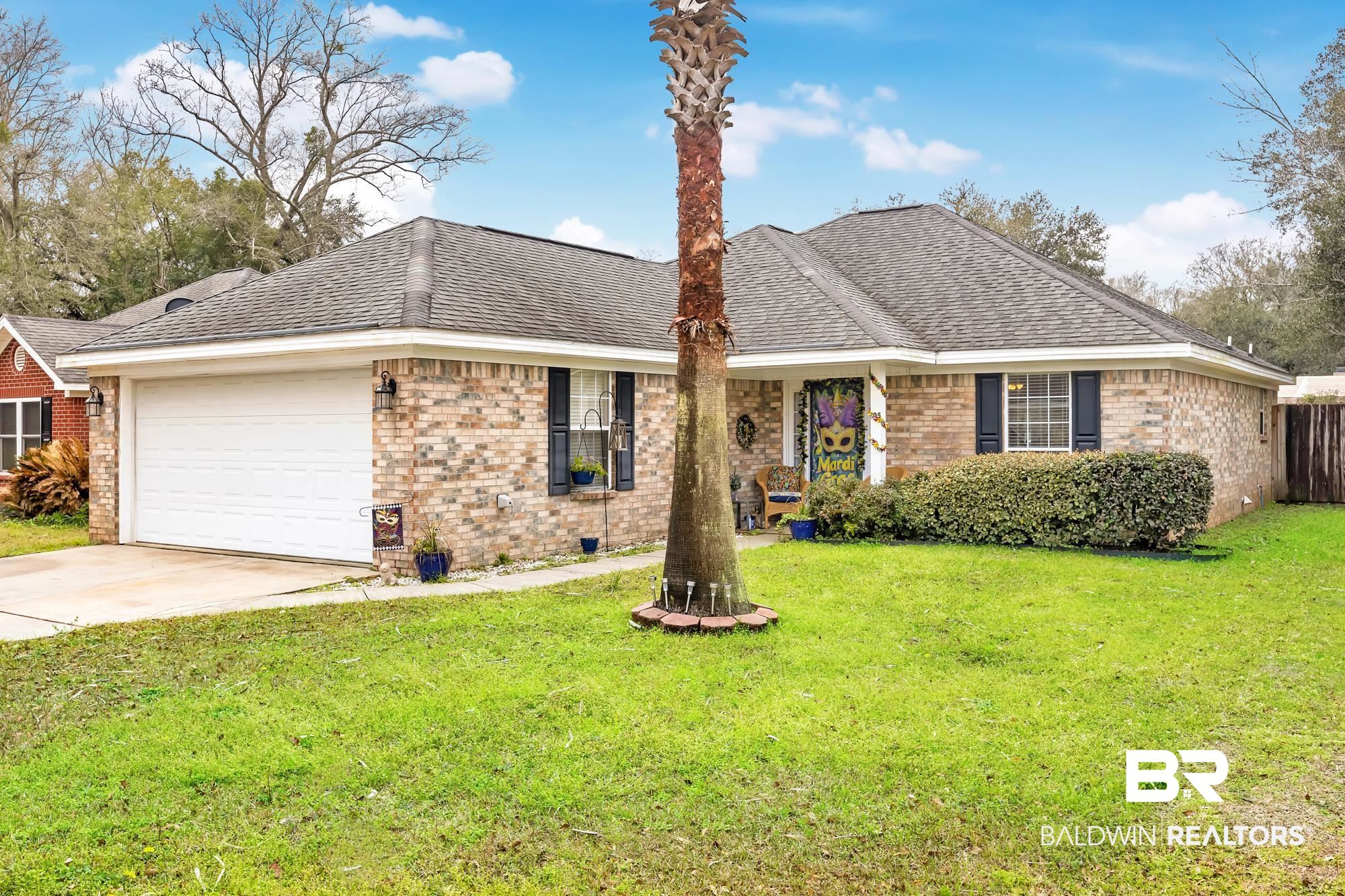 105 Cluster Oaks Court Foley, AL 36535 - Photo 1 of 26 Ranch-style home with brick siding, driveway, a shingled roof, and an attached garage